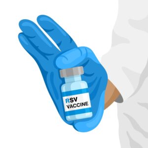 Gloved hand holding a syringe and vaccine vial