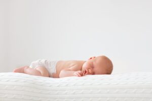 Newborn baby sleeping on their back