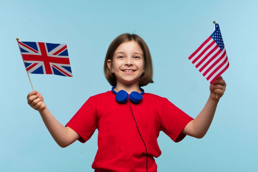 Americal kid wavinh UK & USA flags