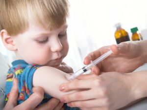 Small boy being vaccinated